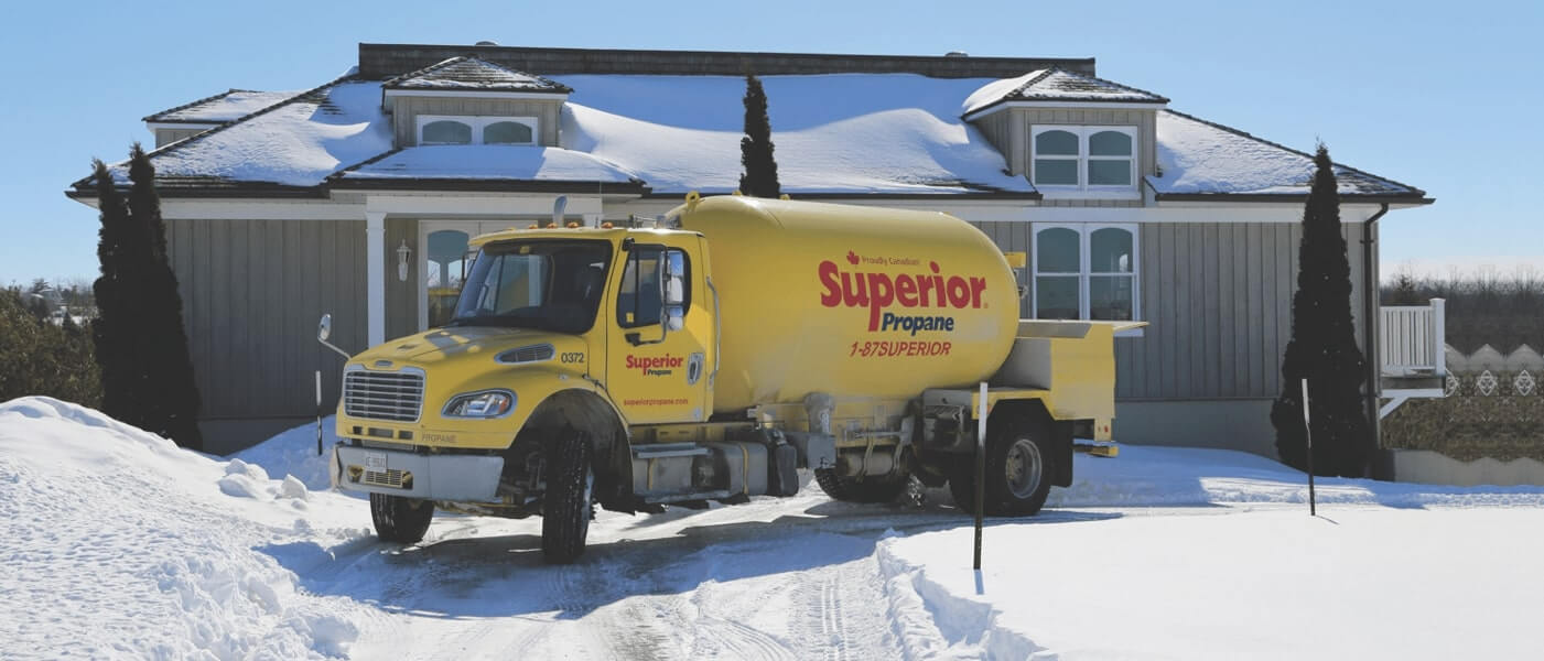 Superior Propane truck making a delivery to a residential home in the middle of winter. 