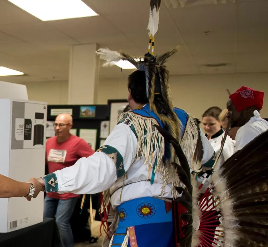 People dancing and holding hands in a circle