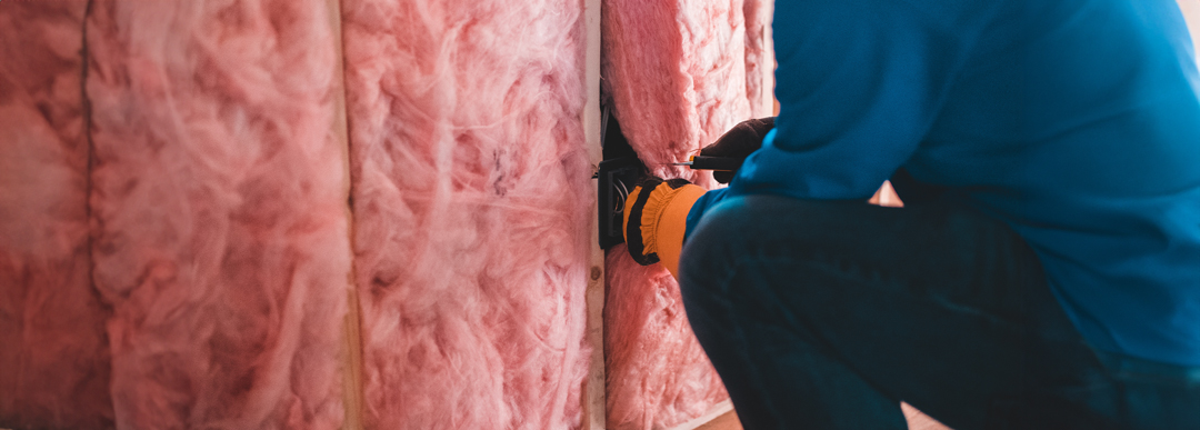 Technician checking home insulation panels