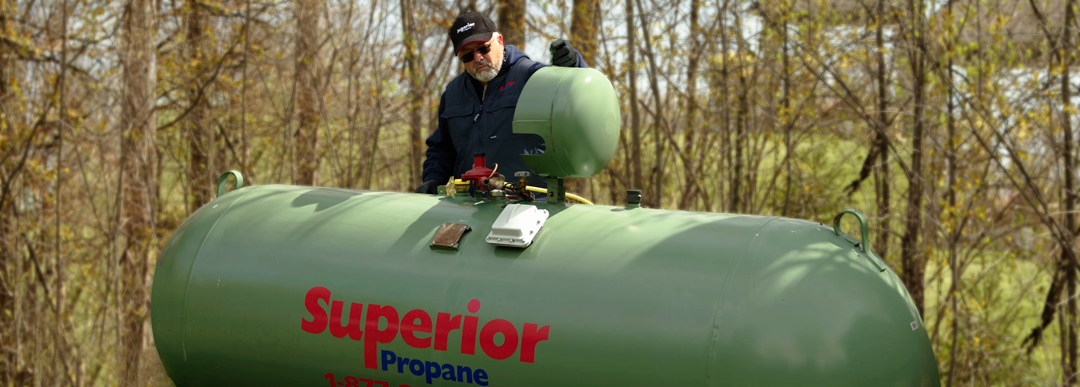 technician servicing propane tank