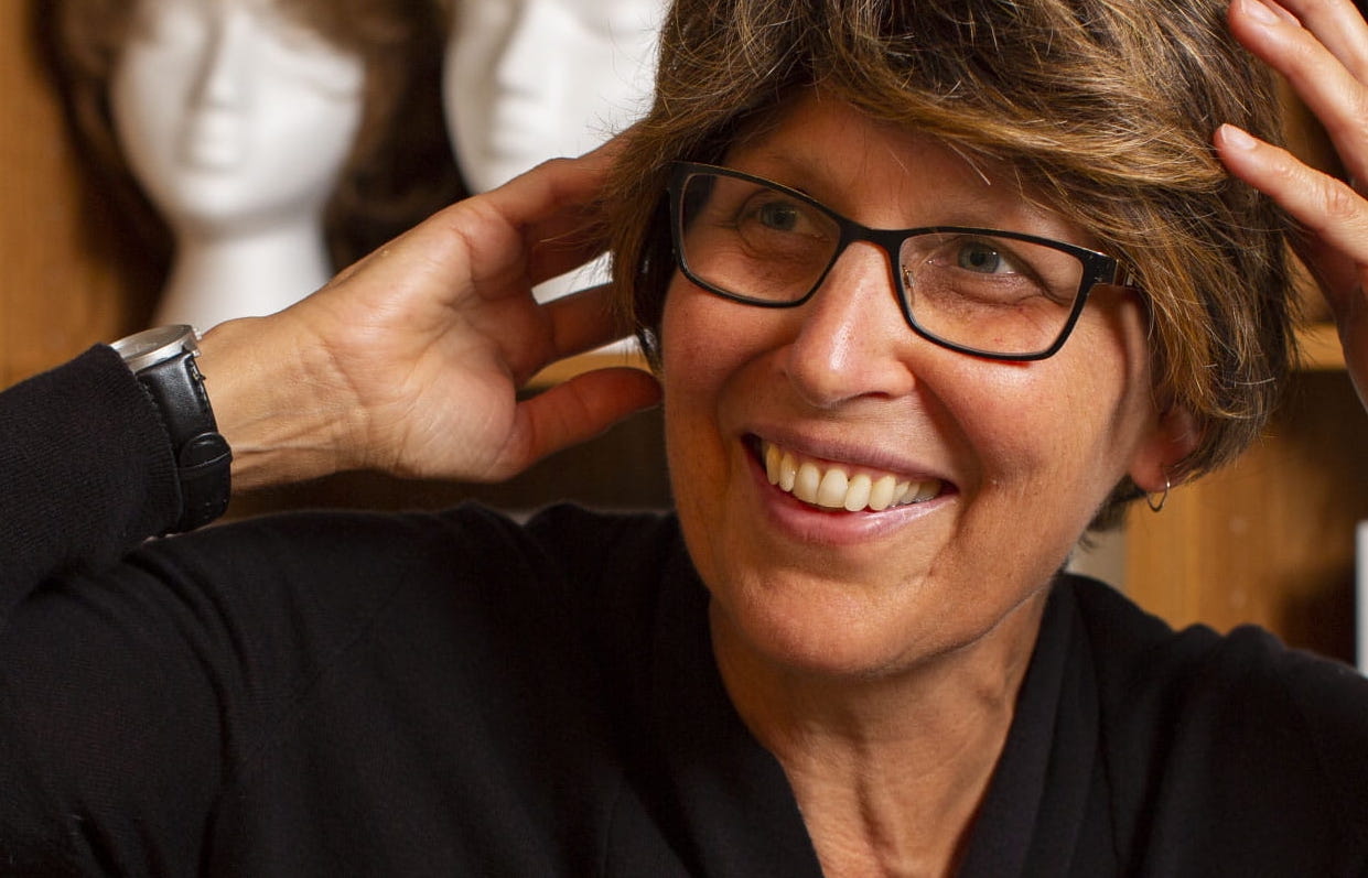 Smiling Wig Bank client wearing new wig