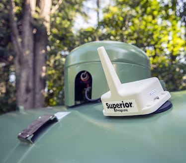 A close-up of a SMART Tank sensor on a green propane tank