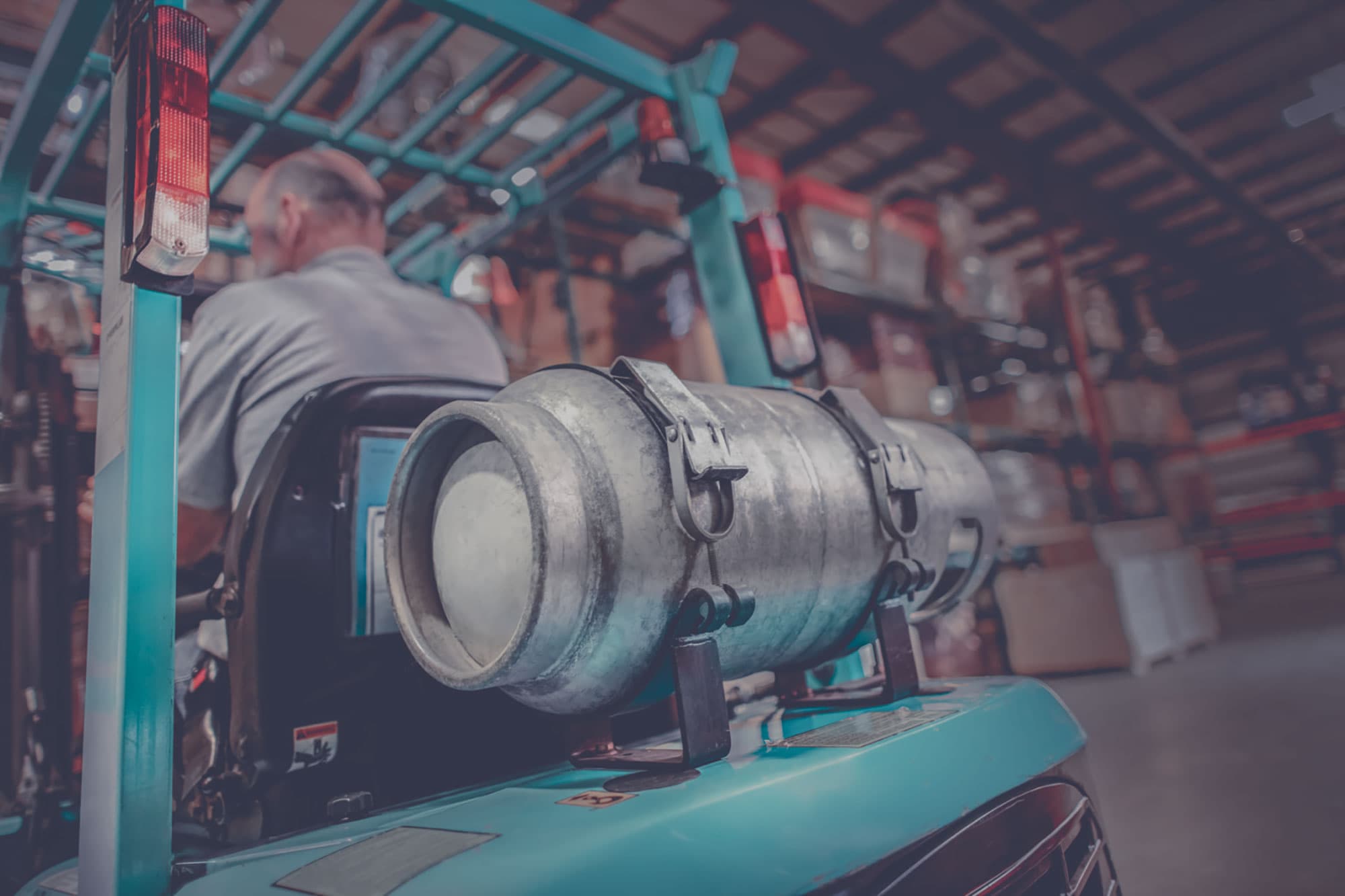 Closeup of a propane cylinder on the back of a forklift. 