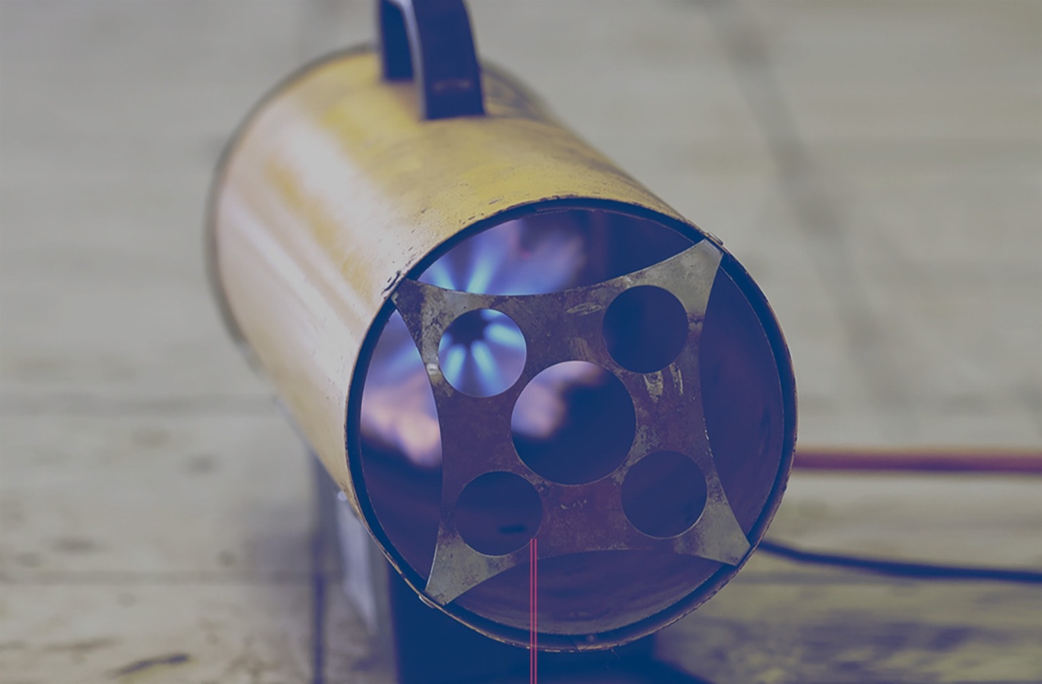 Closeup of a portable propane heater on a construction site. 