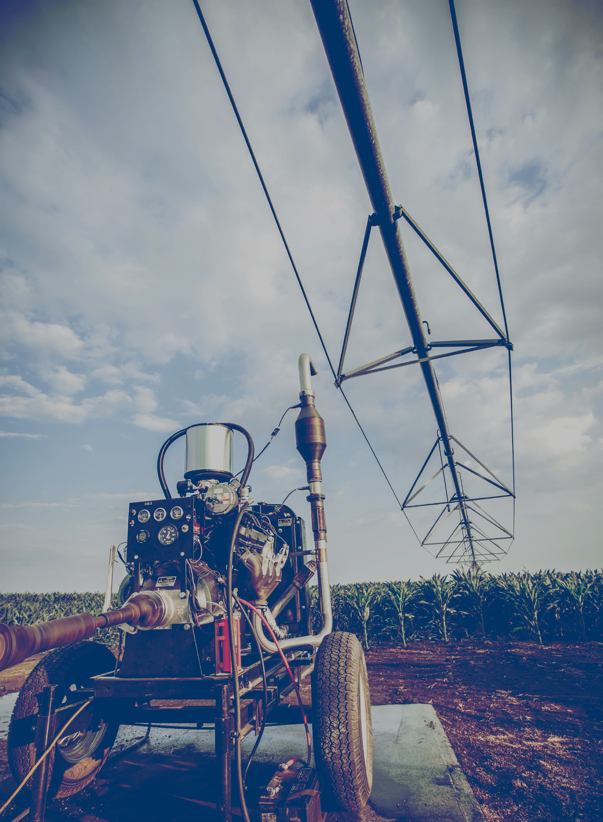 Propane-powered irrigation machine in a field.