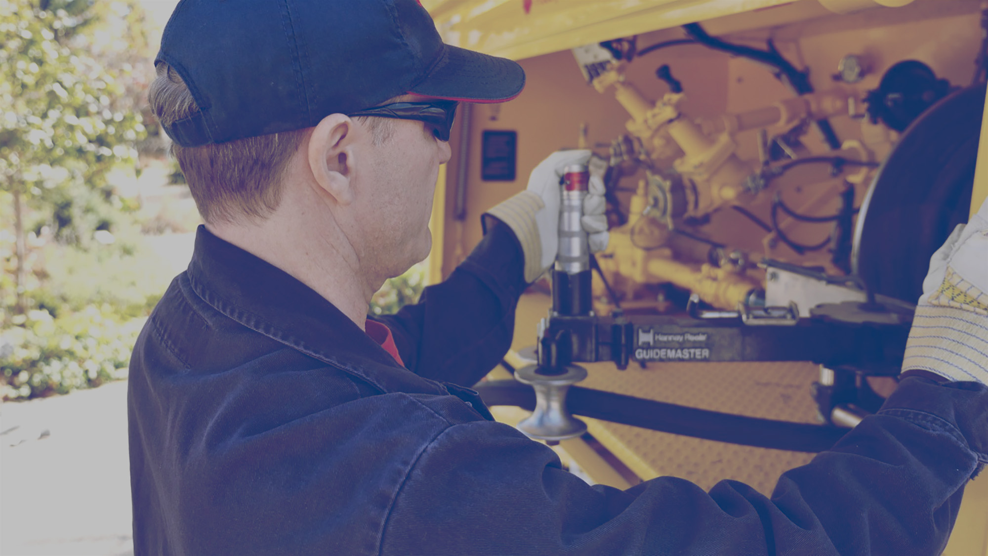 Superior Propane employee refilling a propane cylinder at the back of his truck.