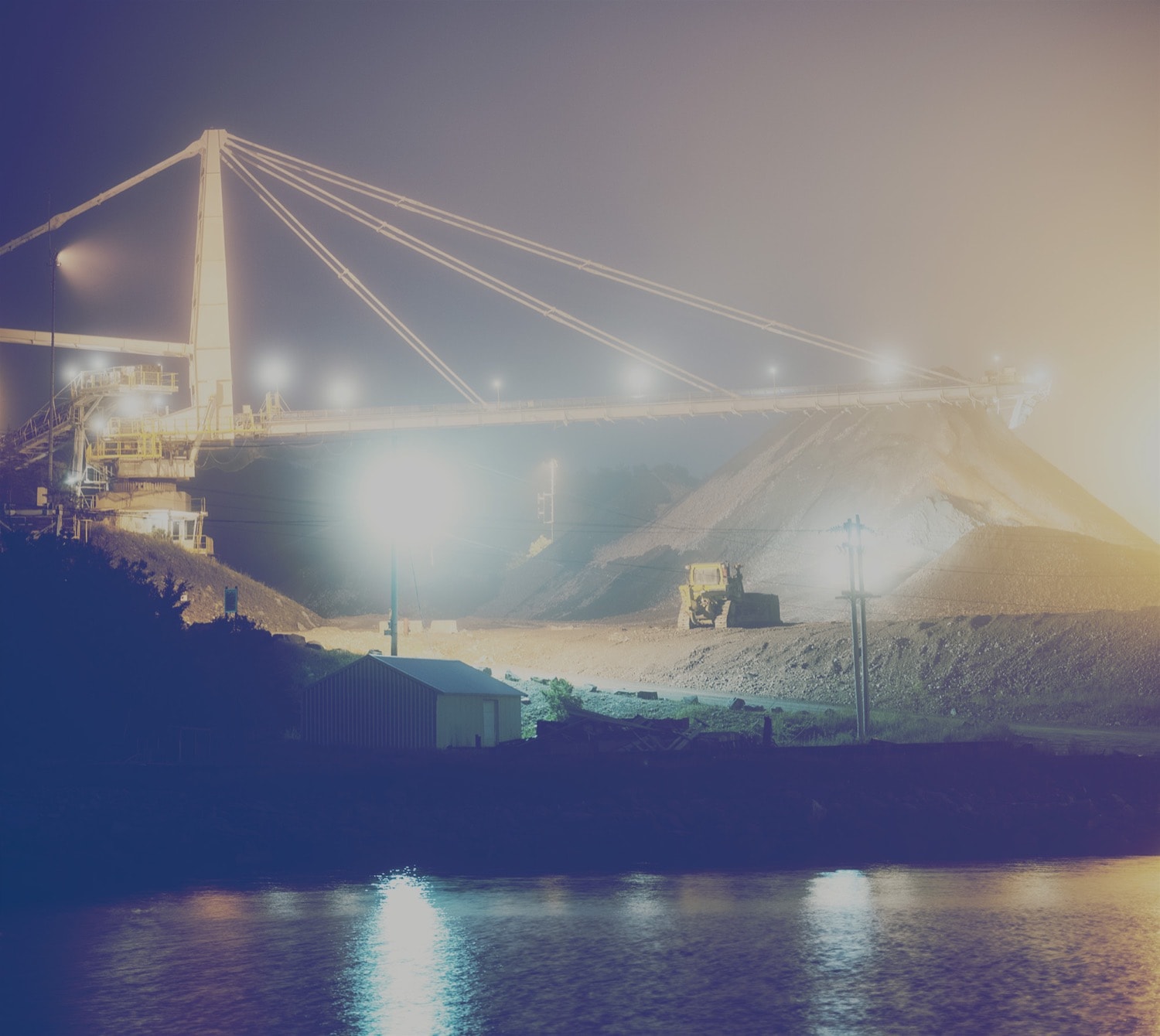 Large crane in a mining pit at night. 