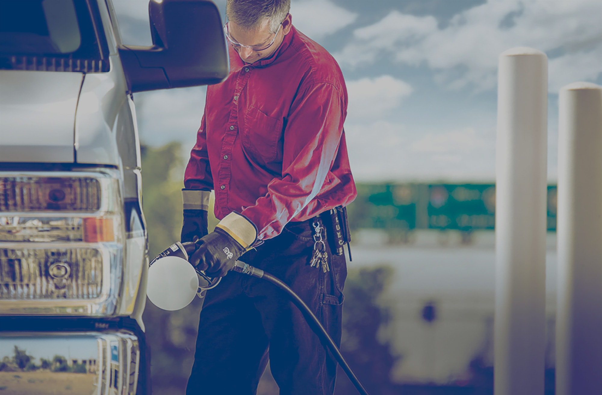 Driver filling a large van with auto propane. 