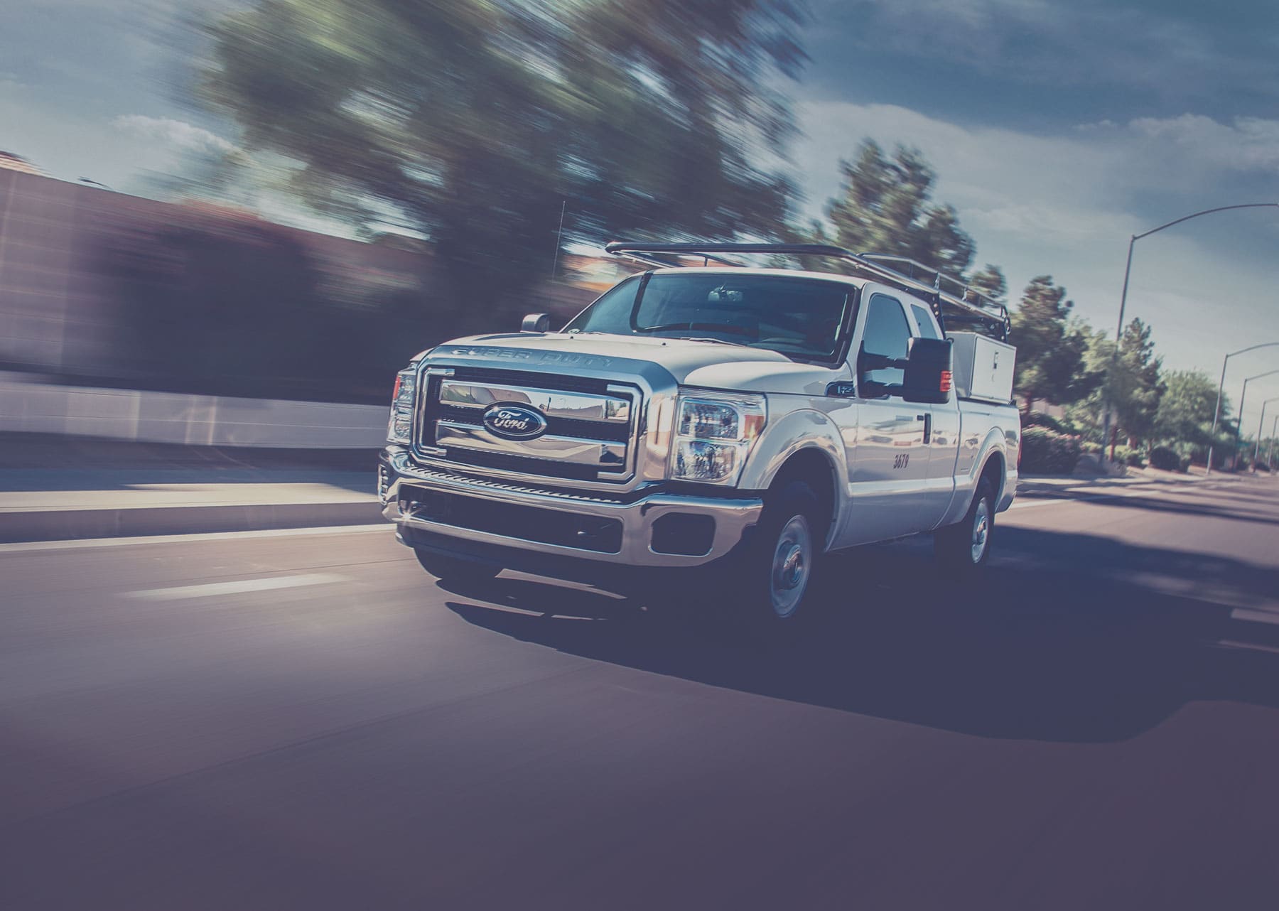 Ford pickup truck fueled by propane autogas driving on the road. 