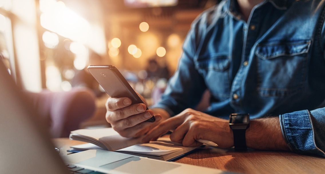 Close up of hands using a mobile phone