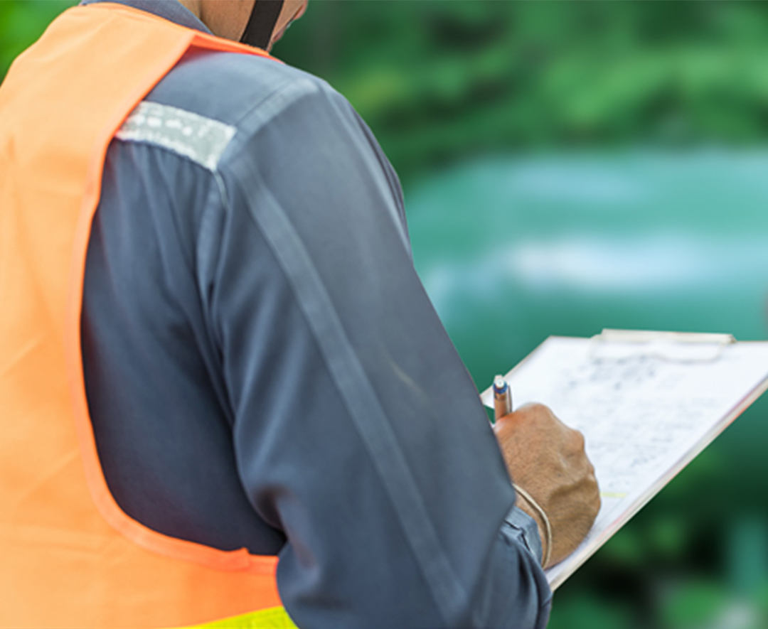 technician inspecting a propane tank