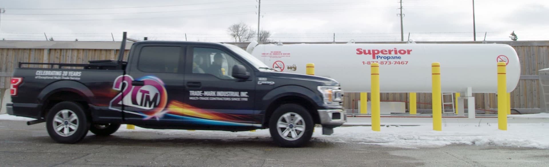 Trade-Mark truck parked in front of a 2,000-gallon tank