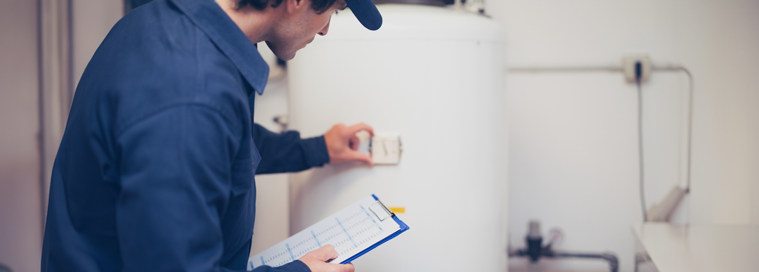 technician inspecting water tank